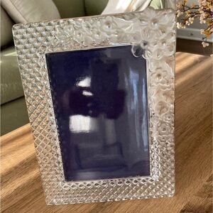 Glass frame. Holds 5x7 photo. Outer measurement 10x7